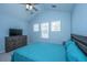 Bedroom features vaulted ceiling, two windows, and light blue walls for a relaxing atmosphere at 718 Kilarney Rd, Summerville, SC 29483