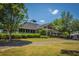 Community center with a spacious covered patio, manicured lawn, and ample space for gatherings at 718 Kilarney Rd, Summerville, SC 29483