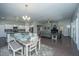 Open floor plan with dining area and living area with hardwood floors and neutral paint at 718 Kilarney Rd, Summerville, SC 29483