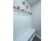 Bright mudroom features hooks for coats and shelves for storage at 718 Kilarney Rd, Summerville, SC 29483