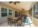 Covered patio features ceiling fans and comfortable seating, perfect for outdoor relaxation at 718 Kilarney Rd, Summerville, SC 29483