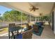 Covered patio features ceiling fans and outdoor seating for relaxing and entertainment at 718 Kilarney Rd, Summerville, SC 29483