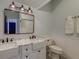 Bathroom features double vanity with marble countertop, stylish lighting and fixtures at 724 Hibbens Grant Blvd, Mount Pleasant, SC 29464
