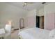 Bedroom featuring a bed, desk, and pink-colored doors creating a bright and cheery atmosphere at 724 Hibbens Grant Blvd, Mount Pleasant, SC 29464