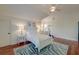 Bedroom with a bed, mirror, wood flooring, ceiling fan, and bright natural light at 724 Hibbens Grant Blvd, Mount Pleasant, SC 29464
