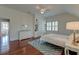 Bedroom displaying wood floors, bed, dresser, mirror, and a ceiling fan at 724 Hibbens Grant Blvd, Mount Pleasant, SC 29464
