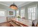 Dining room features large windows, modern lighting, and adjacent access to kitchen at 724 Hibbens Grant Blvd, Mount Pleasant, SC 29464