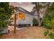 Charming home exterior, showcasing a screened-in porch and mature trees at 724 Hibbens Grant Blvd, Mount Pleasant, SC 29464