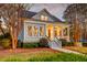 Charming two-story coastal home with a welcoming front porch and manicured landscaping at 724 Hibbens Grant Blvd, Mount Pleasant, SC 29464
