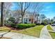 Charming two-story home with a quaint front porch and lush green lawn at 724 Hibbens Grant Blvd, Mount Pleasant, SC 29464