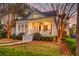 Well-maintained home with inviting front porch, lush lawn, and mature landscaping at 724 Hibbens Grant Blvd, Mount Pleasant, SC 29464