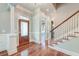 Inviting foyer featuring hardwood floors, staircase, and elegant trim work at 724 Hibbens Grant Blvd, Mount Pleasant, SC 29464
