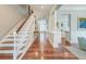 Spacious foyer featuring hardwood floors, staircase, and elegant design elements, perfect for welcoming guests at 724 Hibbens Grant Blvd, Mount Pleasant, SC 29464
