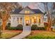 Charming home with a welcoming front porch, manicured landscaping, and traditional architectural details at 724 Hibbens Grant Blvd, Mount Pleasant, SC 29464