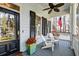 Welcoming front porch featuring a ceiling fan, shutters, and comfortable seating area for relaxing outdoors at 724 Hibbens Grant Blvd, Mount Pleasant, SC 29464