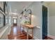 Inviting hallway with hardwood floors, elegant console table, and stairway to the second floor at 724 Hibbens Grant Blvd, Mount Pleasant, SC 29464