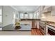 This is a kitchen with stainless appliances, island, granite counters and adjacent to dining room at 724 Hibbens Grant Blvd, Mount Pleasant, SC 29464