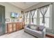 Cozy living room featuring a comfortable couch, ample natural light, and a warm, inviting atmosphere at 724 Hibbens Grant Blvd, Mount Pleasant, SC 29464