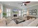 Bright living room boasts a fireplace, built-ins, and ample seating for Gathering and friends at 724 Hibbens Grant Blvd, Mount Pleasant, SC 29464