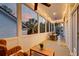 Cozy screened-in porch with string lights, wicker furniture, and views of the outside at 724 Hibbens Grant Blvd, Mount Pleasant, SC 29464