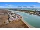 Aerial view of waterfront property showcasing boat docks, nearby attractions, and scenic surroundings at 76 Mariners Cay Dr, Folly Beach, SC 29439