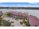 Aerial view showing 76 Mariners Cay with parking, boat docks, and waterway access at 76 Mariners Cay Dr, Folly Beach, SC 29439