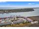 An aerial view shows the location of 76 Mariners Cay relative to waterway and the surrounding area at 76 Mariners Cay Dr, Folly Beach, SC 29439