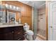 Well-lit bathroom featuring a dark wood vanity, granite countertop, and a glass-enclosed shower creating a spa-like experience at 76 Mariners Cay Dr, Folly Beach, SC 29439