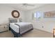 Cozy bedroom with a comfortable bed, soft gray decor, and ample natural light creating a peaceful and inviting atmosphere at 76 Mariners Cay Dr, Folly Beach, SC 29439
