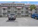 Gray multi-Gathering condominiums with a metal roof and white patios at 76 Mariners Cay Dr, Folly Beach, SC 29439