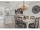Cozy dining area with seating for six and a decorative chandelier in an open-concept layout at 76 Mariners Cay Dr, Folly Beach, SC 29439