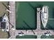 Aerial view of a private dock with multiple boat slips, offering direct water access at 76 Mariners Cay Dr, Folly Beach, SC 29439