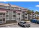 Multi-story condo building featuring covered balconies and ample parking space at 76 Mariners Cay Dr, Folly Beach, SC 29439