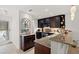 Well-equipped kitchen features granite countertops, stainless appliances, and ample dark wood cabinetry at 76 Mariners Cay Dr, Folly Beach, SC 29439
