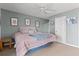 A serene bedroom featuring a large bed with blue accents, soft lighting, and tasteful decorations creating a relaxing atmosphere at 76 Mariners Cay Dr, Folly Beach, SC 29439