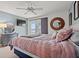 Charming main bedroom with a large bed, waterfront view and a decorative round mirror adding a touch of elegance at 76 Mariners Cay Dr, Folly Beach, SC 29439