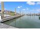 Boat docks in marina with boats and building with cloudy blue sky at 76 Mariners Cay Dr, Folly Beach, SC 29439