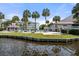 Community pool with sundeck, lounge chairs, and palm trees overlooking the waterway at 76 Mariners Cay Dr, Folly Beach, SC 29439