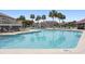 Inviting outdoor pool surrounded by lush palm trees and comfortable lounge chairs for ultimate relaxation and enjoyment at 76 Mariners Cay Dr, Folly Beach, SC 29439