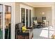 Inviting covered porch with rocking chairs and nautical decor, perfect for relaxing outdoors at 76 Mariners Cay Dr, Folly Beach, SC 29439