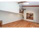 Vaulted living room featuring skylights, fireplace, wood beams, and hardwood floors at 8 Darien Dr, Charleston, SC 29414