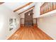 Vaulted living room featuring skylights, fireplace, wood beams, and hardwood floors at 8 Darien Dr, Charleston, SC 29414