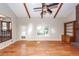 Vaulted living room featuring skylights, fireplace, wood beams, and hardwood floors at 8 Darien Dr, Charleston, SC 29414