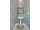 Stylish half bathroom featuring unique wallpaper, a pedestal sink, a wooden frame, and modern fixtures at 824 Forrest Dr, Charleston, SC 29492