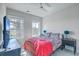 Bright bedroom featuring a TV, two windows, and eclectic decor creating a welcoming atmosphere at 824 Forrest Dr, Charleston, SC 29492