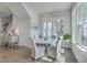 Bright dining area with a round table, comfortable seating, a chandelier, and abundant natural light at 824 Forrest Dr, Charleston, SC 29492