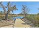 Private dock leading to a tranquil waterfront view, perfect for boating and enjoying nature at 824 Forrest Dr, Charleston, SC 29492