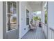 Cozy front porch featuring wood flooring and comfortable seating, perfect for enjoying the outdoors at 824 Forrest Dr, Charleston, SC 29492