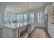 Bright kitchen with a large island, stainless steel appliances, and an adjacent dining area with windows at 824 Forrest Dr, Charleston, SC 29492