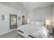 Serene main bedroom featuring a plush bed, soft lighting, and a decorative mirror at 824 Forrest Dr, Charleston, SC 29492